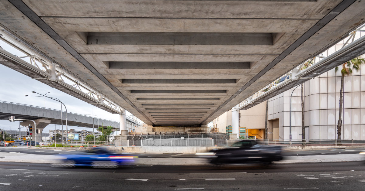 Traffic passing under the newly constructed O'Riordan Bridge, Botany Rail Duplication Project