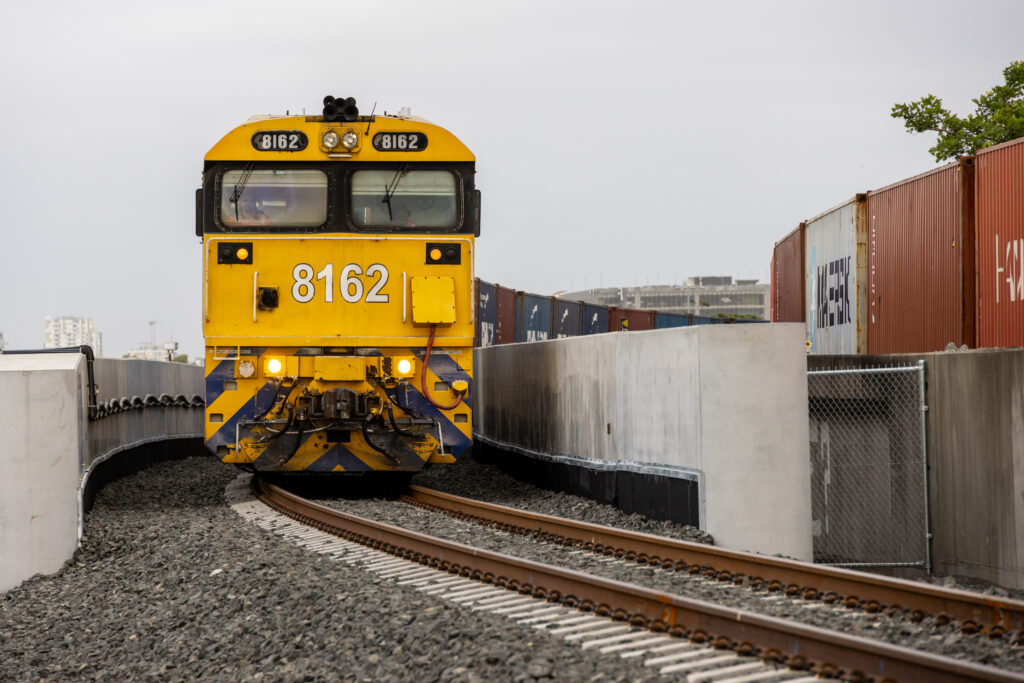 The first train crossing the new bridge over Southern Cross Drive